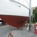 3 coats of Altex Antifoul - on with a roller and brush - great covering